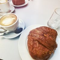 Coffee, ice (for the coffee) and croissant   at CroisSants in Barcelona
