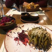 Our main dishes (falafel wrap and bulgur with green beans)  at Sisters' Plant Based in Goreme