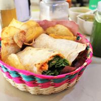 Vegan hummus wrap with crisps. at Trigo Verde in Oaxaca