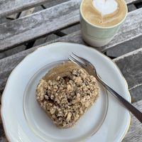 Cappuccino with oat milk and a vegan Streusel-cake  at Bächle in Freiburg
