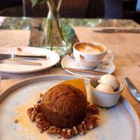 Freshly baked carrot cake 🤌  with vegan ice cream and coffee with plant milk at Pusu Paunksneje Hotel in Palanga