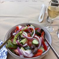 Greek salad with no feta (wine was a house white, good and cheap)  at Bellissimo in Corfu