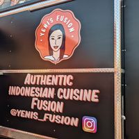 Patio seating (albeit with only 2 tables) and indoor seating in the adjacent bar. at Yeni's Fusion in Austin