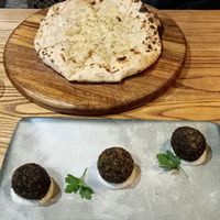 Vegan garlic bread with cheese and truffle arancini with vegan mayo at Lombardi's in Chesterfield