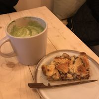 An oat Matcha latte with the lovely croissant cake  at Taylor's Cafe in Brussels
