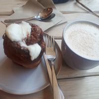 Cappuccino and a cinnamon roll. at Taylor's Cafe in Brussels
