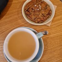 Pistachio cookie and hot ginger drink at Taylor's Cafe in Brussels