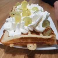 Vegan waffle with whipped cream and fruit at Lody Daktyl Cafe in Gdansk