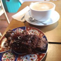 Chocolate cherry gluten free vegan cake and huge oat flat white at Riverside Cafe in Newcastle Emlyn
