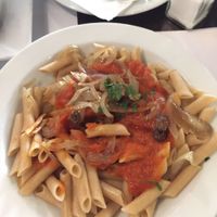 Pasta with tomato sauce and caramelized onions at Vegetariano El Calafate in Malaga