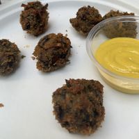 Mushroom nuggets served with mustard.   at Secret Vegan Cafe in Kingston