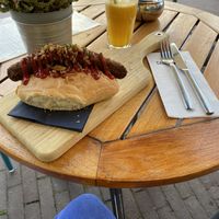 Vegan dog and orange juice at Calf & Bloom in Amsterdam