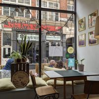 Inside with the outside seating through the window at Bryter Moon Deli in Leicester
