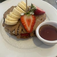 Pancakes with almond butter, strawberry, banana and maple syrupp  at Pog  in Malahide