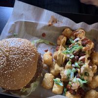 Smash burger with loaded tots  at Green Kitchen in Cleveland