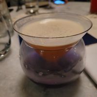 Alcoholic drink served over dry ice. at ROOH in San Francisco