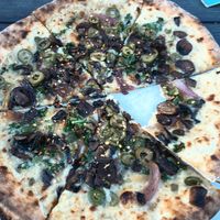 Vegan mushrooms with green olives at Pizza Creature in Portland