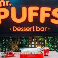 https://www.nou-pou.gr/food-drink/glyko/mr-puffs-oi-diasimoi-ellinikoi-loukoumades-tou-kanada-pou-kanoun-thrafsi-sti-glifada/ at Mr. Puffs in Glyfada