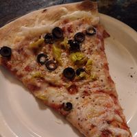 Black olives and pepperoncinis with vegan cheese. at North Fork Brewery in Deming