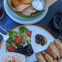 Falafel plate and zucchini fries in background at EATERY in Athens