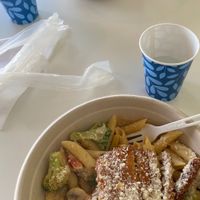 Pepper steak bowl (top) and Cajun chicken pasta (bottom-cashew sunflower cream sauce with Cajun seasoning, vegan chicken tenders, broccoli, mushrooms, bell peppers, vegan parmesan) at Loving Hut in Reynoldsburg