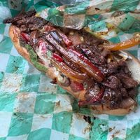 Grilled steak sandwich (marinated textured vegetable protein, onion, bell peppers, mushroom, cheese, mayo, lettuce, and tomato on hoagie bread) at Loving Hut in Reynoldsburg