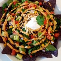 taco salad - greens, tomatoes, red onion, black beans, corn, "cheese", "chorizo", avocado, southwest spice dressing, & "sour cream" w/ tortilla chips at Loving Hut in Reynoldsburg