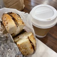 Toasted everything bagel with tofu cream cheese and oat milk latte  at Finns Bagels in New York City
