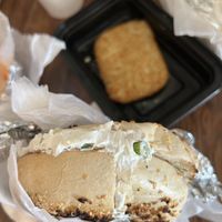 Toasted onion bagel with scallion tofu cream cheese and a hash brown  at Finns Bagels in New York City