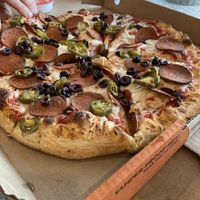 Vegan cheese and vegan pepperoni, olives and Jalapeños   at Pizza Pizza in Toronto