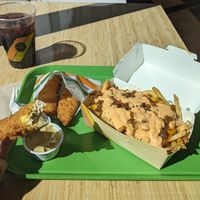 Chicken tenders with honey mustard sauce, iconic fries... blueberry soda at Plant Power Fast Food - Craig Rd in Las Vegas