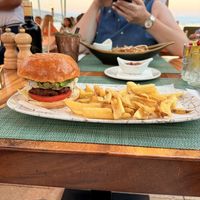 Burger, I added chimichurri to it, and dipped my chips in aioli   at Siso Beach in Mallorca