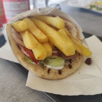 I don't know if you're supposed to eat it with the fries on it but we did and it was so yummy at Gyros House in Kalampaka