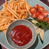 French fries with fresh vegetables at Ievos Skanėstai in Gargzdai
