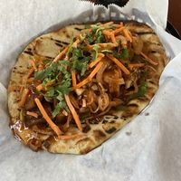 Vegan sandwich potatoes onions bell pepper carrots cilantro and a vegan sauce on a vegan flatbread and absolutely delicious pairs extremely well with the ginger mint lemonade  at It's a Punjabi Affair in Amarillo