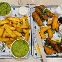 Assortment of tofish bites, lemon prawns, battered sausages, chips & mushy peas  at The No Catch Co in Brighton
