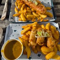 Jumbo battered saveloy and chips. Battered sausage and chips with curry sauce. at The No Catch Co in Brighton