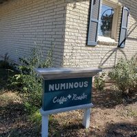 Outside sign at Numinous Coffee Roasters in Marble Falls