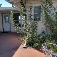 Back entrance and outside seating at Numinous Coffee Roasters in Marble Falls