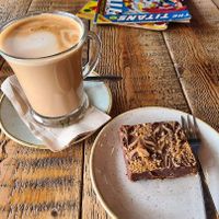 Oatmilk latte and chocolate tiffin at ComiCoffee in Newport