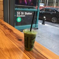 Mr. Greenjeans Smoothie, looking out the side window of  venue--note the subway stop right outside. at Juice Generation in New York City