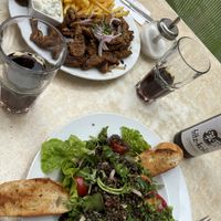 Lentil salad and vegan soy gyros with fries.  at Dada in Regensburg