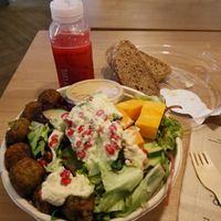 The falafel tahini bowl with bread on the side included at MUC - Dean & David - T2 in Munich