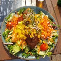 Colourful sweet potato kumpir with vegan cheese sauce at JOHO Broiler in Prerow