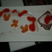 Raw Chocolate tart with strawberry and coconut sauces at Waterfall Villas in Dominical