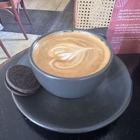 Flat white with oat milk came with an Oreo cookie 🍪   at Root25 in East London