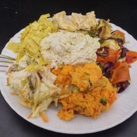 live food week plate - yellow soy curd, marinated tofu, veg stir fry, carrot salad, coleslaw, garlic tofu spread at The Miznon in Dimona