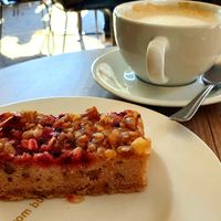 Vegan banana currant cake with oat cappuccino at Coffee Fellows - Berliner Allee in Dusseldorf