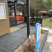Nice seating on the deck with pergola, or tables on the lawn.  at Naked Vegan in Greenville