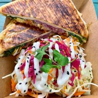 Breakfast burrito with side slaw at Cavendish Cafe in Brighton